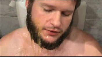 Daddy pissing on son in the bathroom