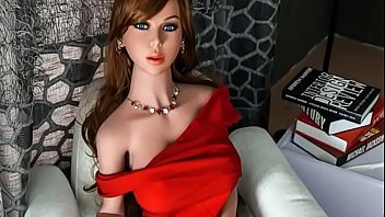 Mature brunette sex doll in long red dress